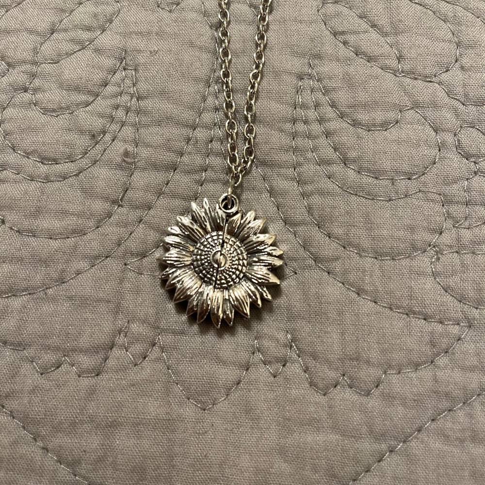 Silver tone sunflower necklace.  Can be worn 21-23”. Please read insid…